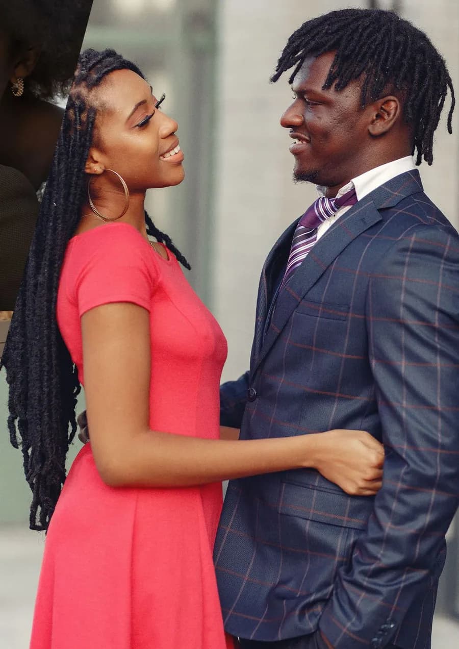 Un couple élégant se faisant face et souriant